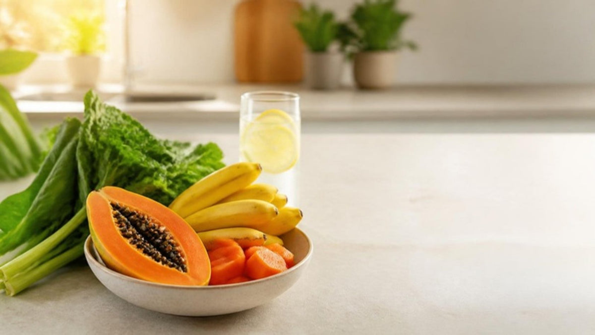 Fresh bowl of tropical fruit with water and leafy greens on a bright kitchen counter - reduce water retention naturally